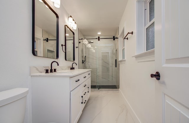 full bathroom with double vanity, marble finish floor, a marble finish shower, and toilet