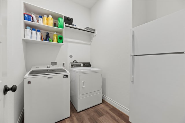 2122 Rosybill Dr, Katy, TX 77494 - washroom with baseboards, laundry area, dark wood-type flooring, and washing machine and clothes dryer