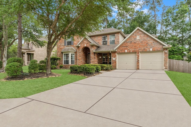 view of front facade with a garage, brick siding, fence, a front lawn, and concrete driveway