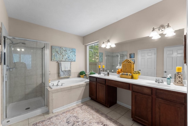 full bath with double vanity, tile patterned floors, a shower stall, and a bath