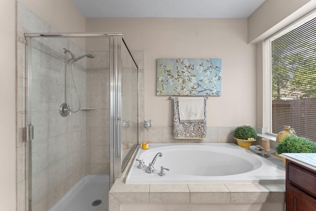 full bath with a garden tub, a stall shower, and vanity