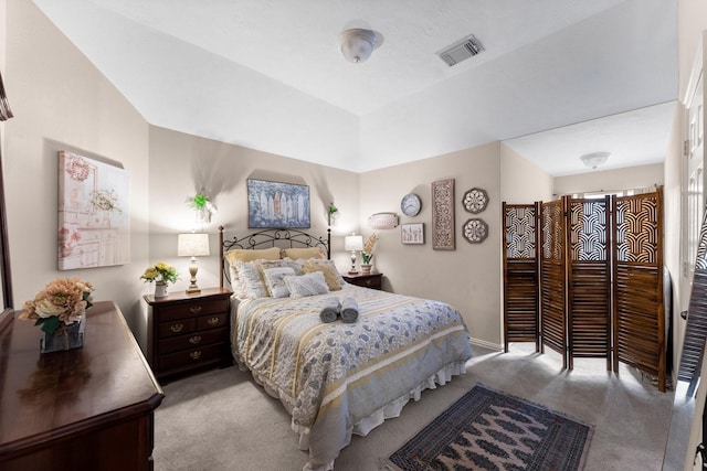 carpeted bedroom featuring visible vents and baseboards