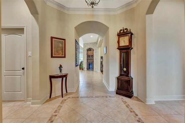 hall with baseboards and arched walkways