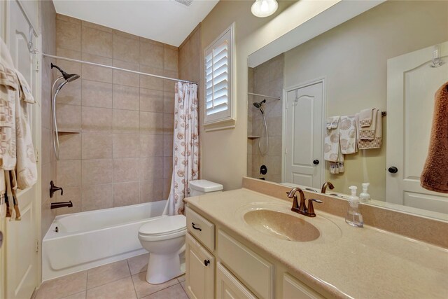 bathroom with toilet, tile patterned floors, shower / bathtub combination with curtain, and vanity