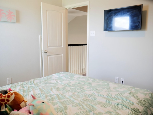 bedroom with lofted ceiling