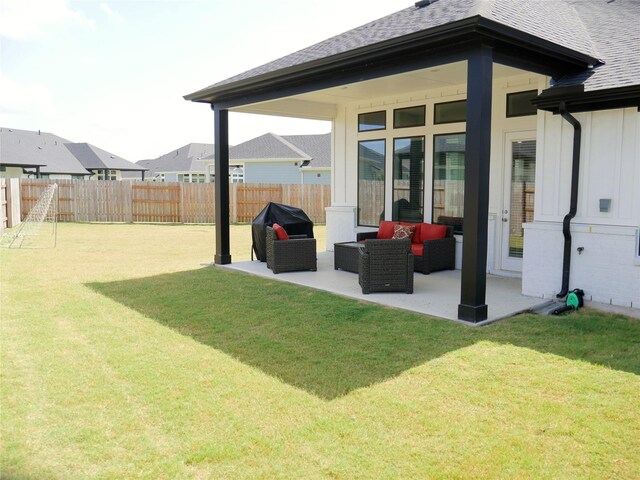 view of yard featuring a patio, outdoor lounge area, and a fenced backyard