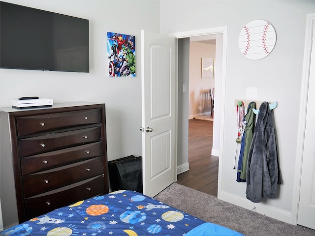 carpeted bedroom with baseboards