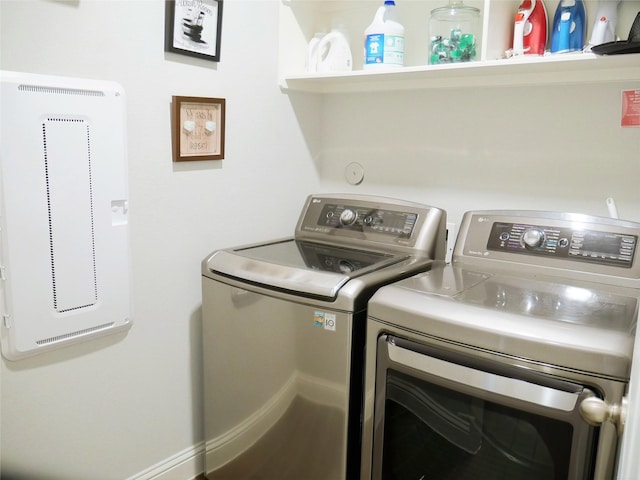 clothes washing area with laundry area and washer and clothes dryer