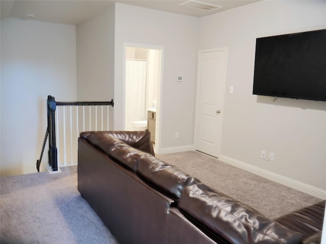 carpeted living room with baseboards and visible vents