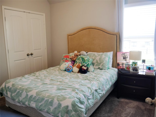 bedroom featuring a closet and carpet flooring