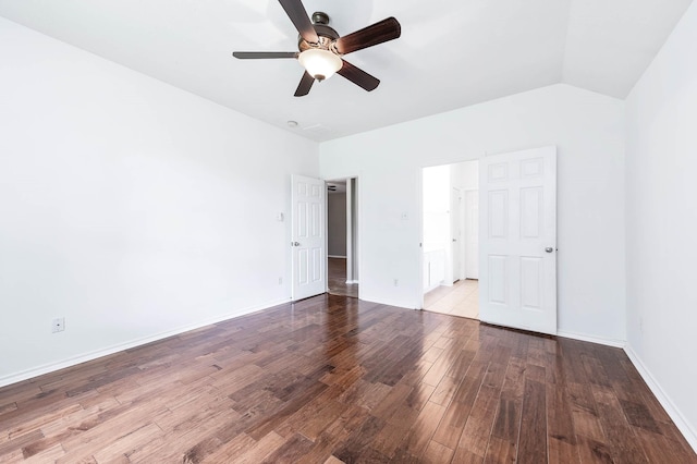 unfurnished bedroom featuring wood finished floors, vaulted ceiling, baseboards, and ceiling fan