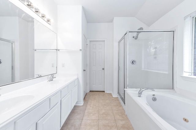 bathroom with a shower stall, a whirlpool tub, double vanity, tile patterned flooring, and vaulted ceiling