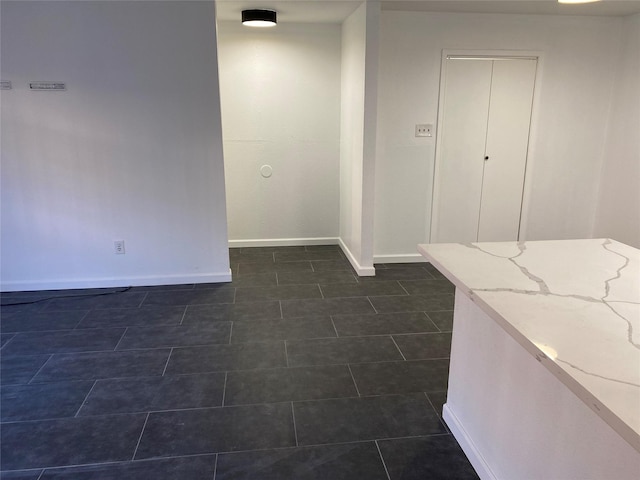 interior space featuring baseboards