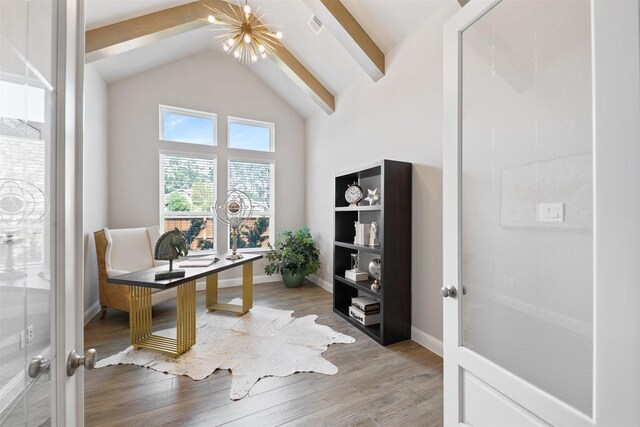 home office with visible vents, light wood-style floors, baseboards, high vaulted ceiling, and a chandelier