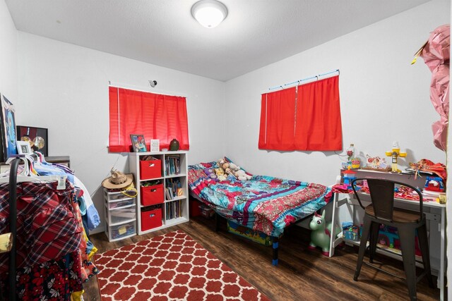 bedroom with wood finished floors