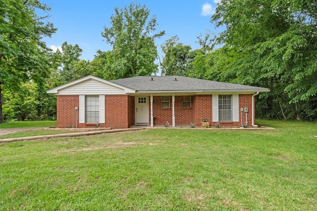 single story home featuring brick siding and a front lawn