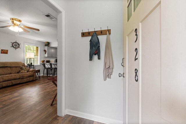 mudroom with visible vents, a ceiling fan, baseboards, and dark wood-style floors