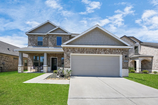 craftsman-style house with driveway, a front lawn, and brick siding