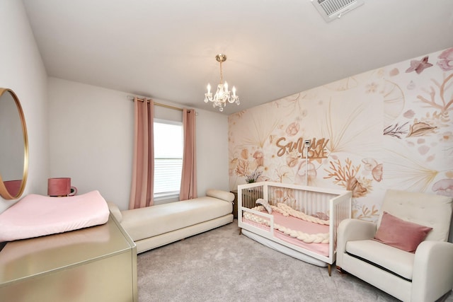 carpeted bedroom featuring an inviting chandelier and visible vents