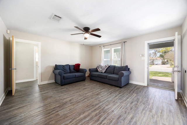 415 N Meyer St, Sealy, TX 77474 - living room with a ceiling fan, baseboards, visible vents, and dark wood-type flooring