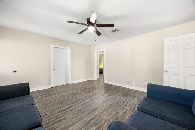 415 N Meyer St, Sealy, TX 77474 - living area featuring a ceiling fan, baseboards, dark wood finished floors, and visible vents