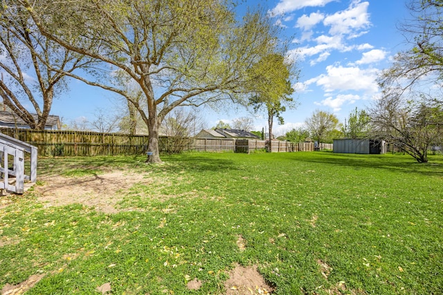 415 N Meyer St, Sealy, TX 77474 - view of yard featuring fence and an outbuilding