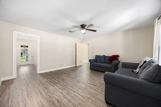 415 N Meyer St, Sealy, TX 77474 - living area featuring baseboards, ceiling fan, and wood finished floors