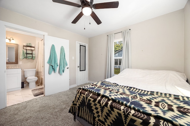 415 N Meyer St, Sealy, TX 77474 - bedroom featuring a ceiling fan, baseboards, and ensuite bath