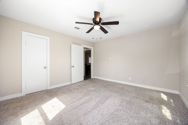 415 N Meyer St, Sealy, TX 77474 - unfurnished bedroom with visible vents, carpet flooring, baseboards, and ceiling fan