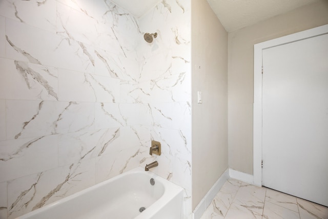 415 N Meyer St, Sealy, TX 77474 - bathroom with baseboards, marble finish floor, and shower / bathing tub combination