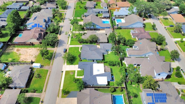 birds eye view of property with a residential view