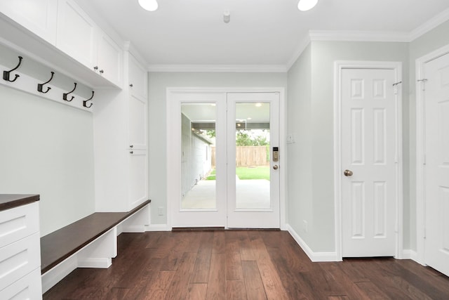 mudroom featuring crown molding, baseboards, and dark wood-style floors