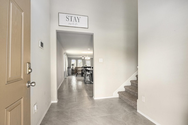 23706 Bluewood Trce, Tomball, TX 77375 - tiled foyer entrance featuring stairs and baseboards