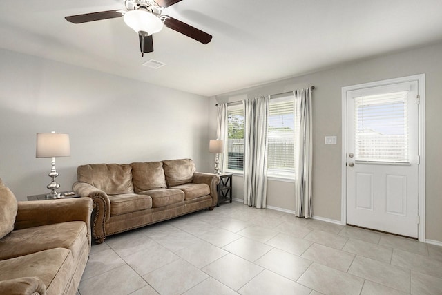 23706 Bluewood Trce, Tomball, TX 77375 - living room featuring ceiling fan, light tile patterned flooring, and baseboards