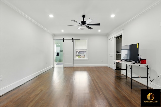 unfurnished living room with crown molding, a ceiling fan, recessed lighting, and a barn door