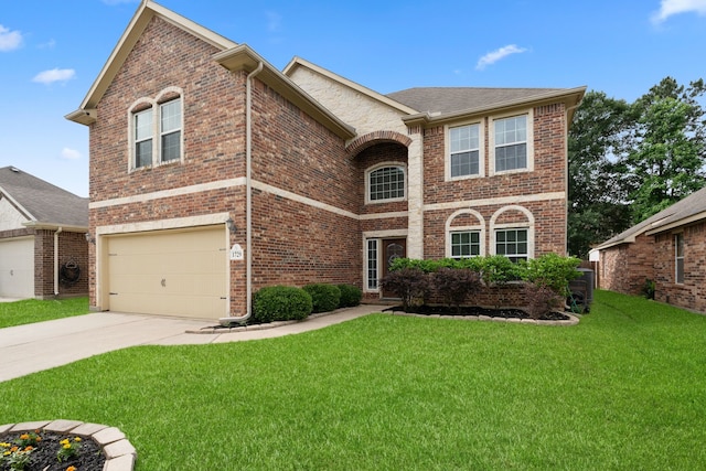 traditional home with concrete driveway, brick siding, a front lawn, and a garage