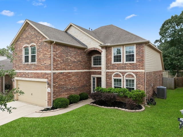 traditional home with central air condition unit, brick siding, an attached garage, and a front lawn