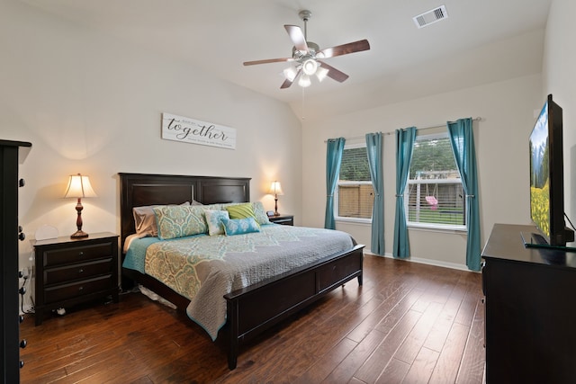 bedroom featuring visible vents, baseboards, ceiling fan, and dark wood-style floors