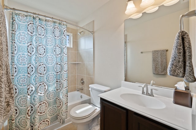 bathroom with vanity, toilet, and shower / tub combo with curtain