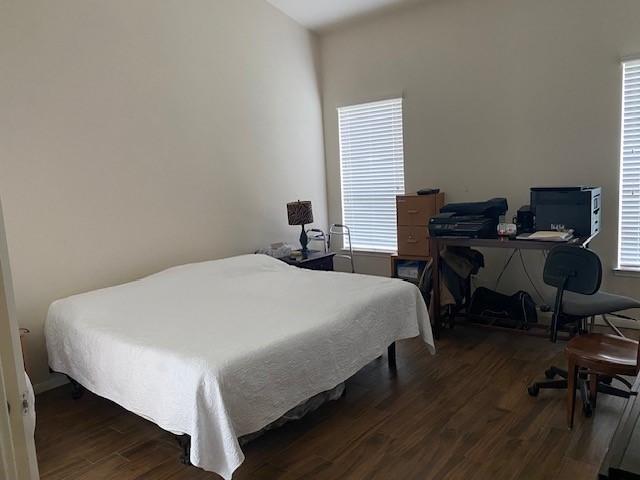 bedroom with wood finished floors