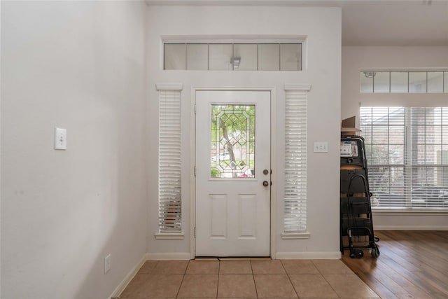 102 Pebble Walk Ln, Dickinson, TX 77539 - foyer entrance with baseboards and light wood finished floors