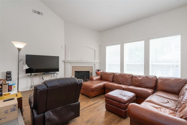 102 Pebble Walk Ln, Dickinson, TX 77539 - living area featuring lofted ceiling, light wood finished floors, and a fireplace