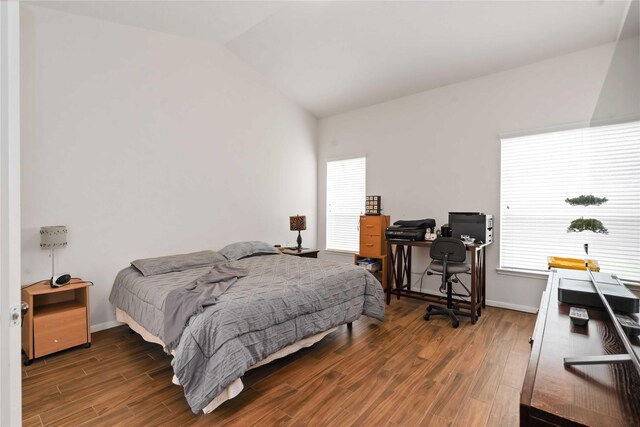 102 Pebble Walk Ln, Dickinson, TX 77539 - bedroom featuring wood finished floors, lofted ceiling, an office area, and baseboards