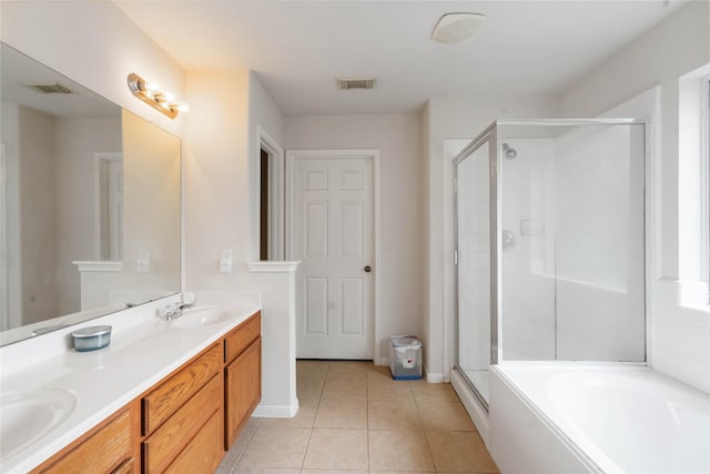 102 Pebble Walk Ln, Dickinson, TX 77539 - bathroom with a stall shower, tile patterned flooring, double vanity, a garden tub, and baseboards