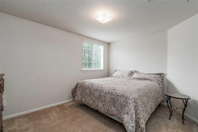 102 Pebble Walk Ln, Dickinson, TX 77539 - bedroom with carpet flooring, baseboards, and a textured ceiling