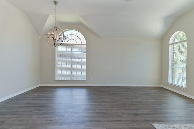 empty room featuring baseboards, dark wood-type flooring, a chandelier, and lofted ceiling