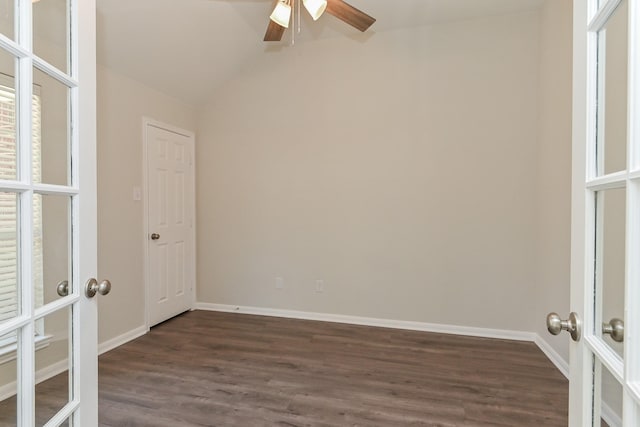 empty room featuring baseboards, a ceiling fan, french doors, and dark wood-style floors