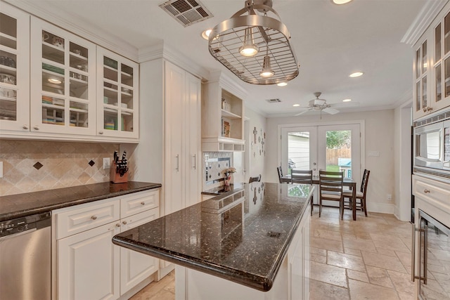 kitchen featuring decorative backsplash, visible vents, appliances with stainless steel finishes, stone tile flooring, and recessed lighting