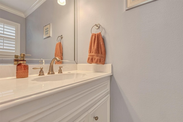 bathroom featuring ornamental molding and vanity