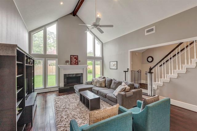 living room with high vaulted ceiling, plenty of natural light, beamed ceiling, and ceiling fan